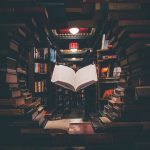 a book flying in lots of other books