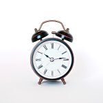 clock on white surface