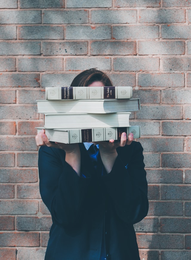 person holding books