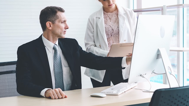 persons discussing business problems