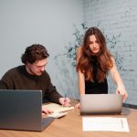 two persons cooperate